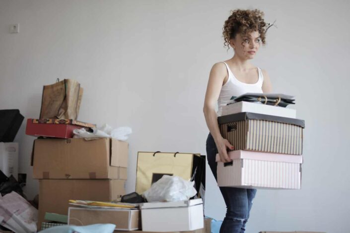 Woman busy packing up her things