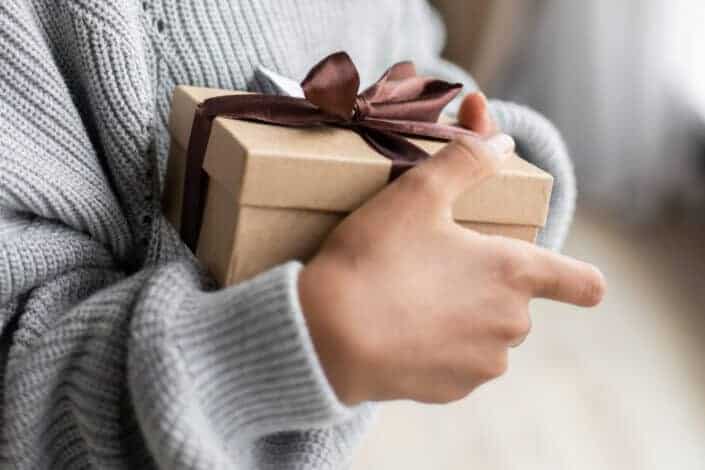 Woman holding a box of gift