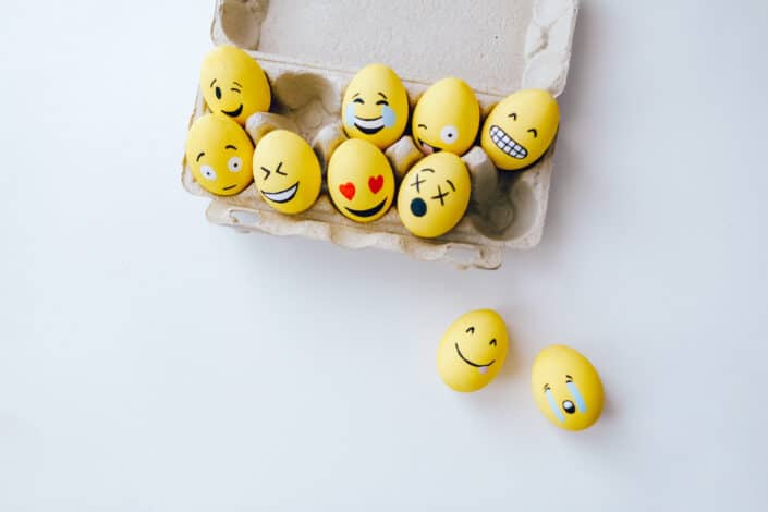 Different emoticons painted on eggs