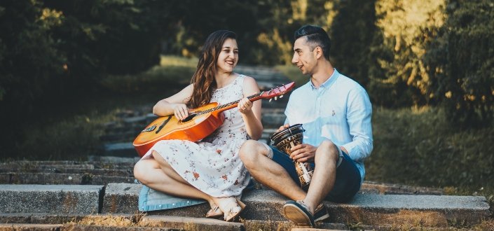 couple playing instrument together
