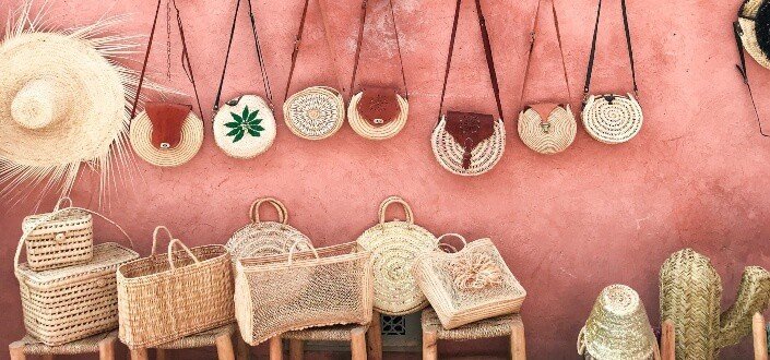 photography of straw hats and bags