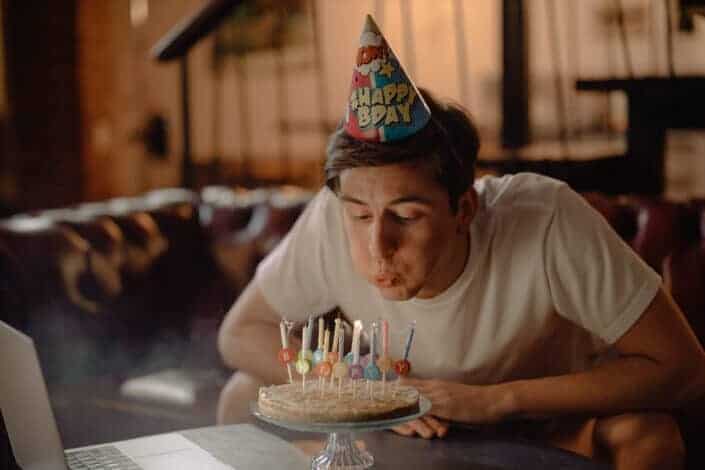 Man blowing his birthday candles