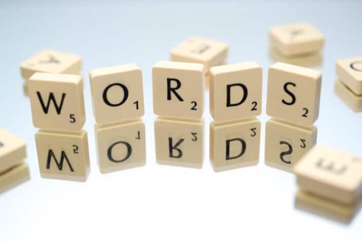Scrabble letters arranged to spell WORDS.