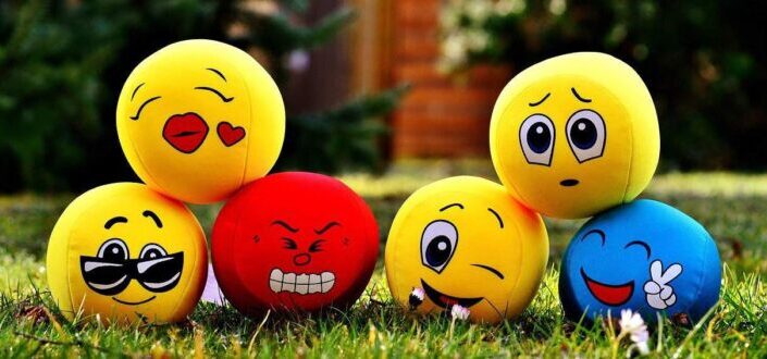 Colorful Emoticon Balls Piled Up on the Lawn
