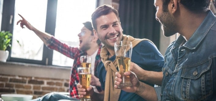 Three men drinking beer