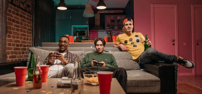 Men playing a game while having sleepover