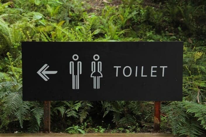 A toilet locator signboard.