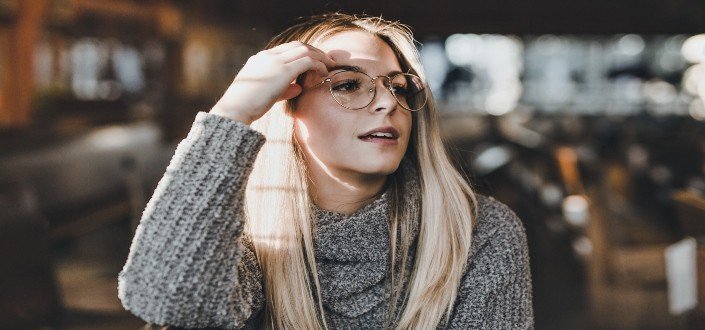 Woman wearing glasses looking afar 