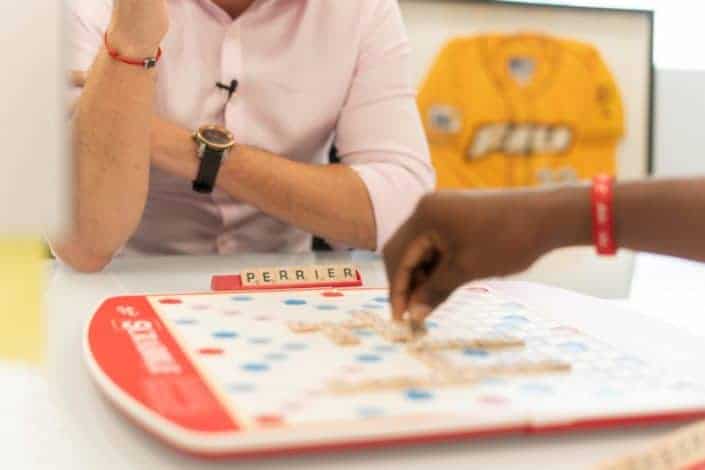 Two persons playing scrabble